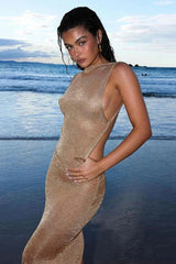 Eloura – Shimmer maxi dress with open back and minimalist cut